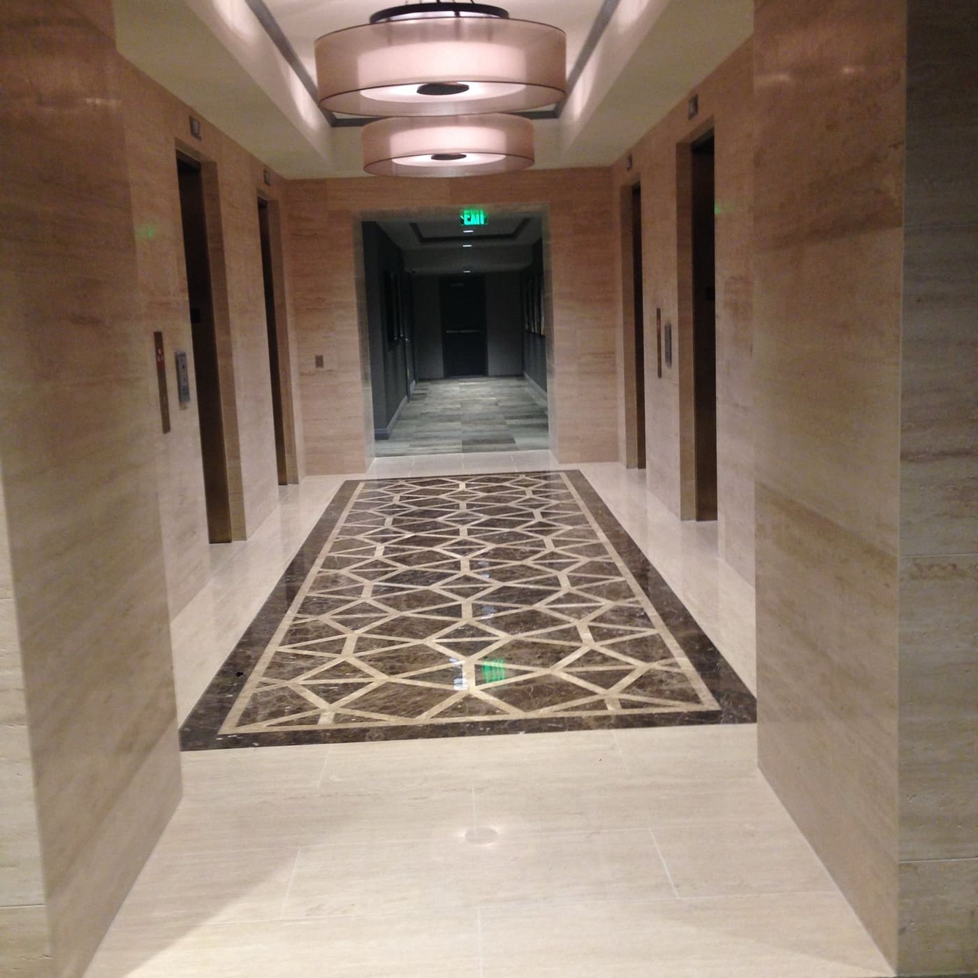 Finished stone lobby floor installed by Cangelosi Company