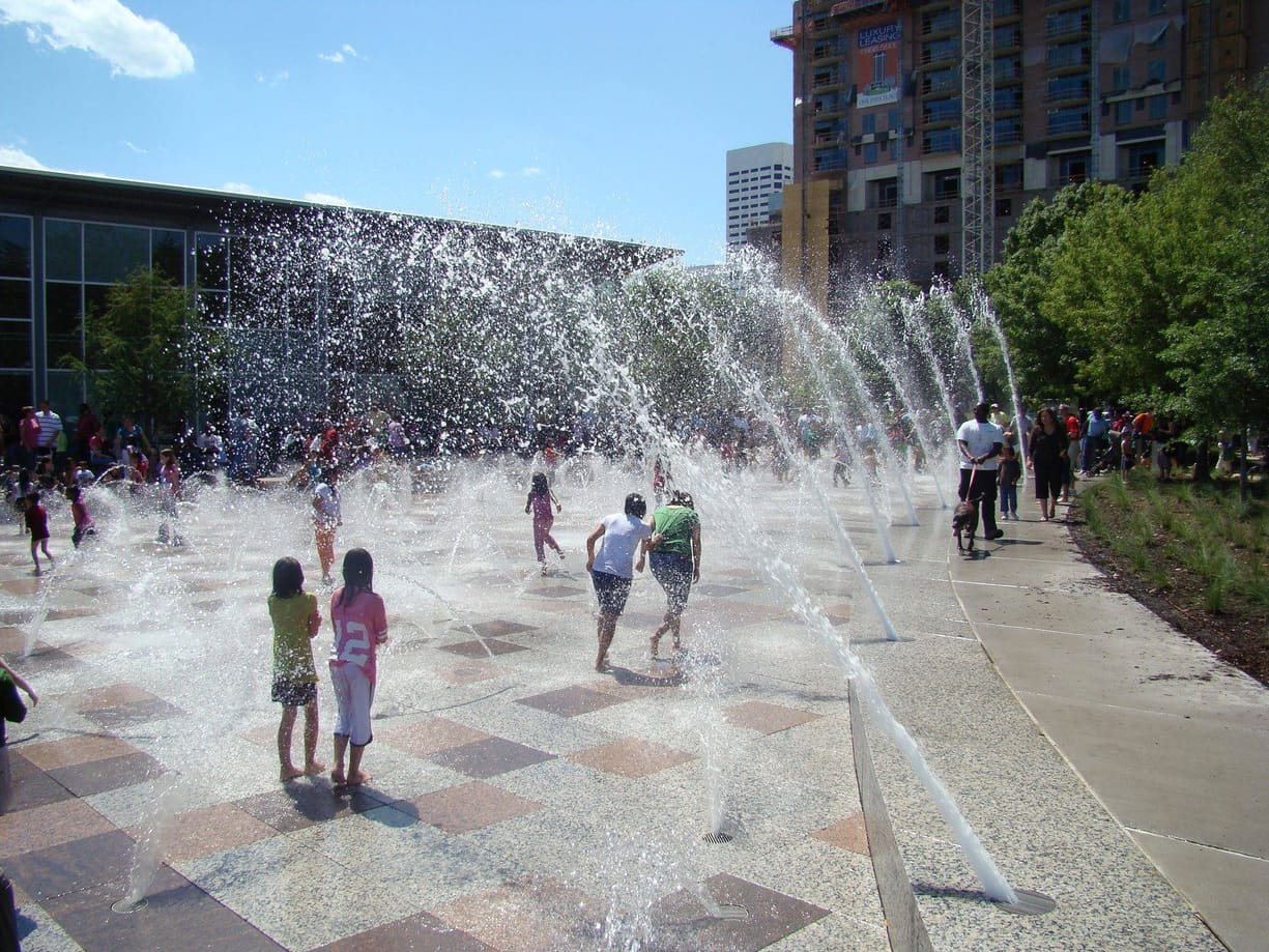 Stone plaza and fountain surround by Cangelosi Company