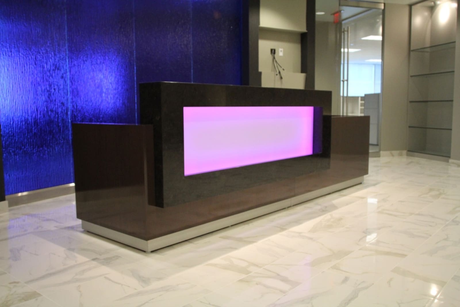 Custom stone reception desk fabricated by Cangelosi Company