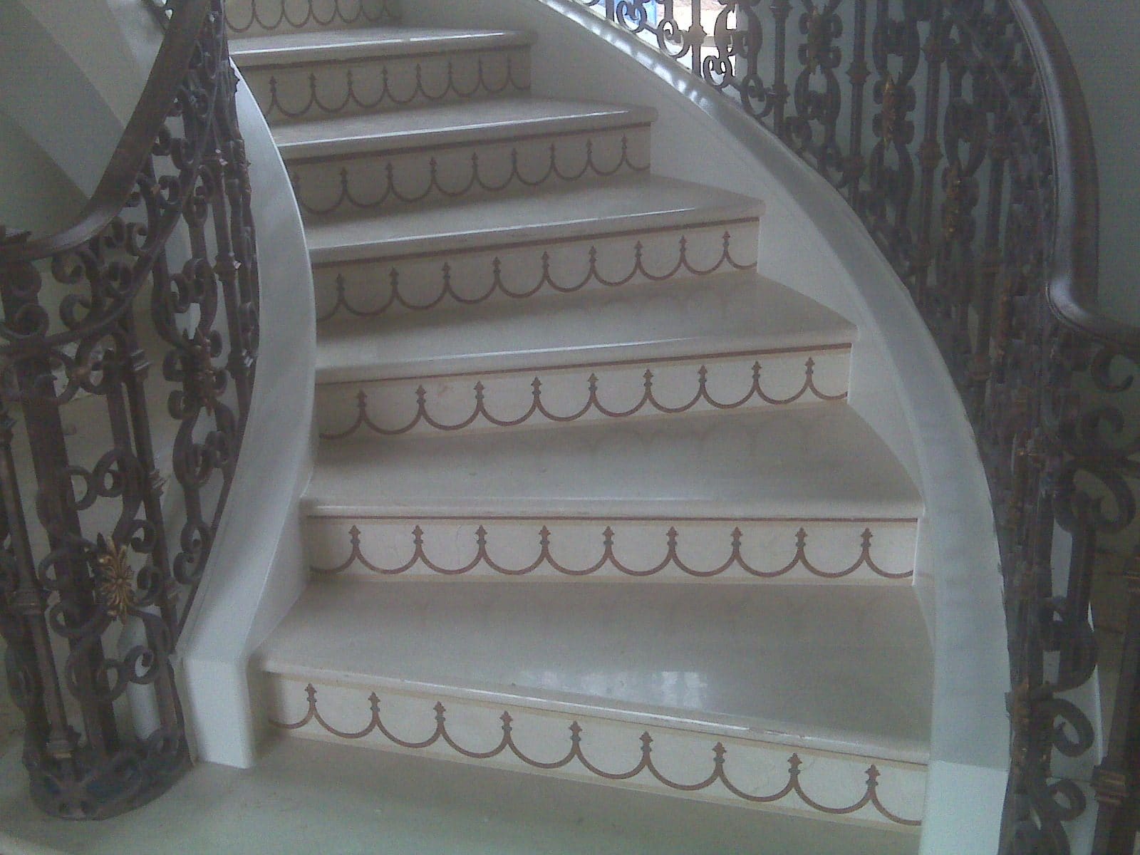 Curved stone staircase fabricated and installed by Cangelosi Company