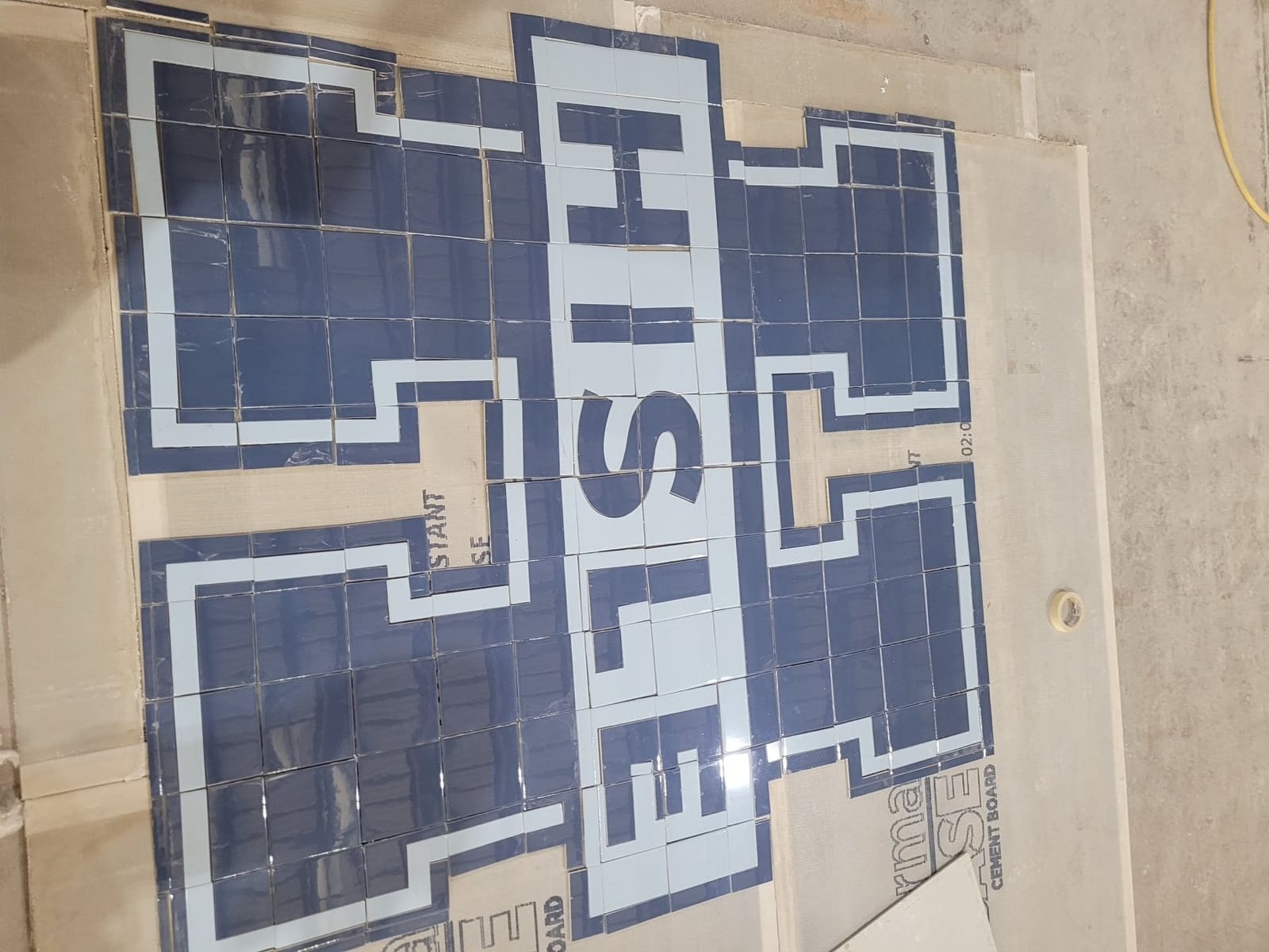 Waterjet-cut school logo medallion fabricated by Cangelosi Company